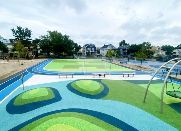 Municipal large play area with green and blue bounds